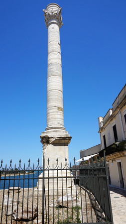 Ancient roman column, which is a landmark of Brindisi, Puglia, Italyの写真素材