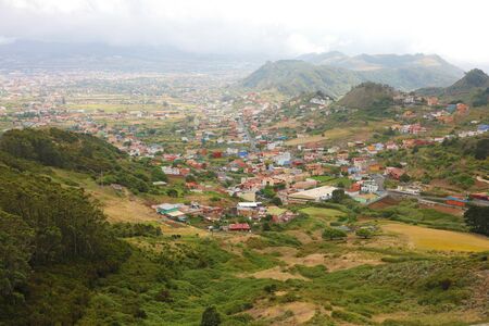 Panoramic view of Tenerife Island with San Cristobal de la Laguna city and Teide volcano on the background from Mirador de Jardina viewpoint, Spain.の写真素材