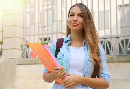 Serious student girl looking in front of her outdoors.の写真素材