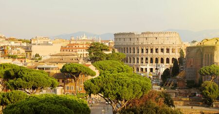 Rome cityscape skyline with landmarks of the Ancient Rome: Coliseum and Roman Forum famous travel destinations of Italy.の写真素材