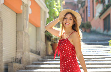 Portrait of happy travel tourist woman on Salita Serbelloni in Bellagio on Lake Como. Girl on summer vacation visiting famous tourist destination in Italy.の写真素材