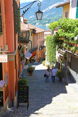 BELLAGIO, ITALY - JUNE 23, 2020: picturesque and colorful old town street Salita Serbelloni in Bellagio town, Italyのeditorial素材