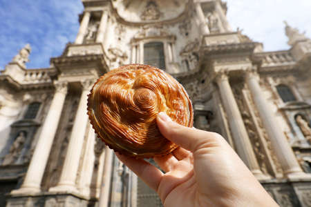 Pastel de carne murciano (Murcian meatloaf) with Cathedral of Murcia, Spainの写真素材