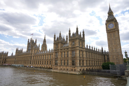 Palace of Westminster informally known as the Houses of Parliament with Big Ben tower on the north bank of the River Thames in the City of Westminster, in central London, Englandのeditorial素材