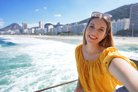 Brazilian girl enjoying takes self portrait on her vacation in Rio de Janeiro, Brazilの写真素材
