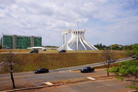 BRASILIA, BRAZIL - AUGUST 30, 2023: Sight on Brasilia the futuristic city with the Cathedral designed by Oscar Niemeyer, Brazilのeditorial素材