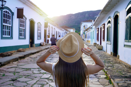Traveler girl in the historic colonial village of Tiradentes at sunset in Brazilの写真素材