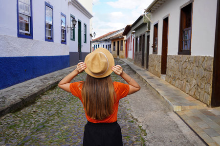 Traveler girl walking in the historic center of Sao Joao del Rei, Minas Gerais, Brazilの写真素材