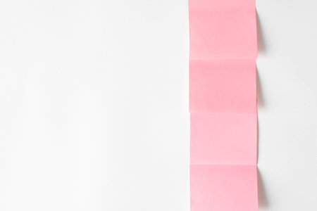 Collection of pink stickers on white wall, copy spaceの写真素材