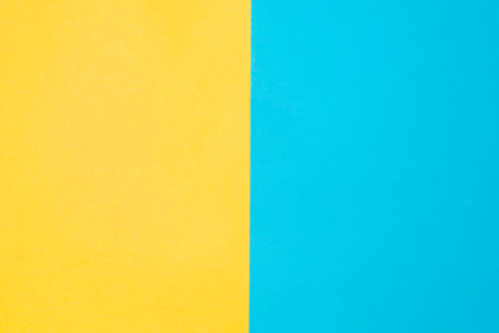 Top view texture paper background. Yellow-blue colored backdrop. Two vertical backgroundsの写真素材