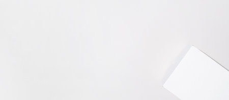 White box mock up banner, copy space. Small cardboard box with closed lid on a light background, top viewの写真素材