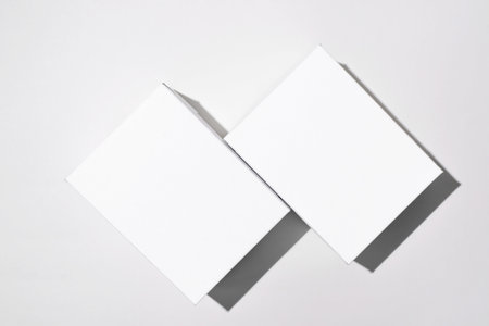 Two white blank boxes mock up. Small cardboard boxes on a light backgroundの写真素材