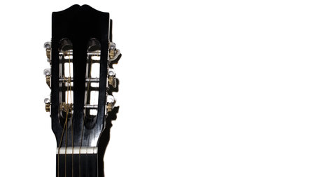 Guitar fretboard on a white background close-up. Classical acoustic guitar, copy spaceの写真素材