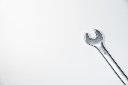 Single steel gray wrench for repair on a white background. top view, copy spaceの写真素材