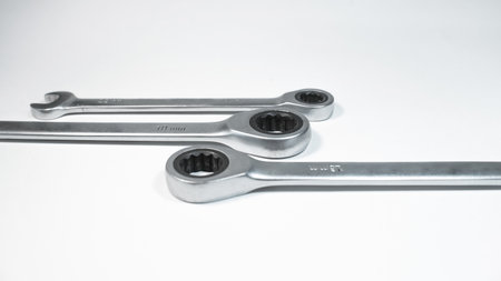 Set of combined steel gray wrenches for repair on a white background. close-up