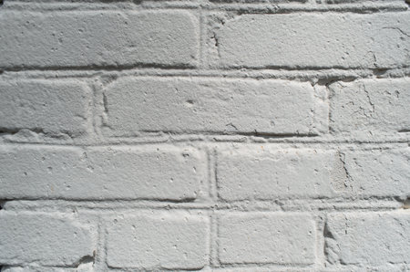 White brick wall texture background, close-up. natural light, vignetteの写真素材