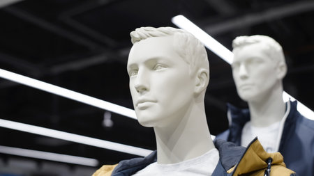 Male mannequins in outerwear in a store, close-up.の写真素材