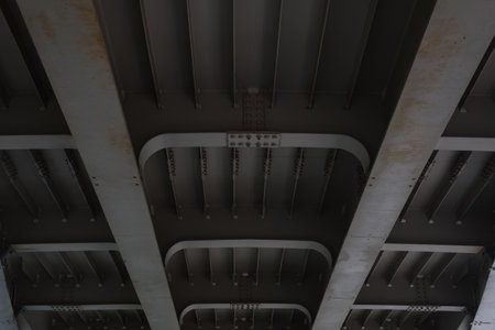 Closeup building structure of modern iron bridge, bottom view. Perspective, selective focus.の写真素材