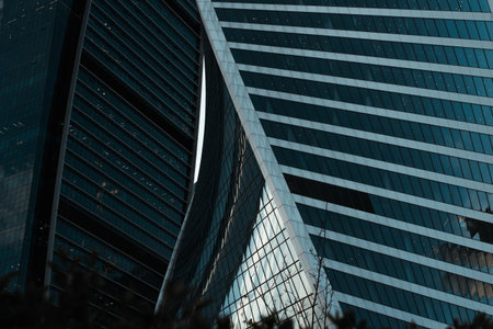 Close-up modern architecture, high-rise buildings swirling in a spiral, business financial center,...