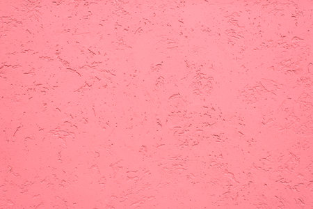 Wall texture with decorative light red poster. Copy space textured background.