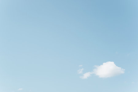 White cloud against blue clear sky, heavenly minimalistic landscape, rule of thirds. Copy space,...