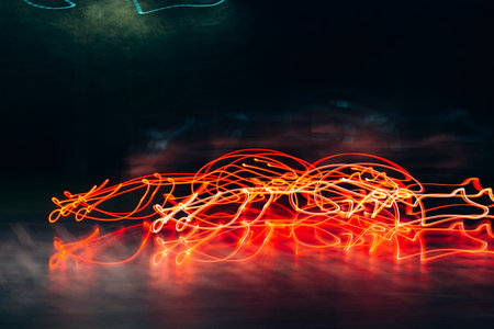 Bright lights in motion at night blurry, abstract defocus background. Night city, red lights, car...