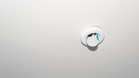 Broken led light panel on stretch white ceiling indoors, copy space.の写真素材