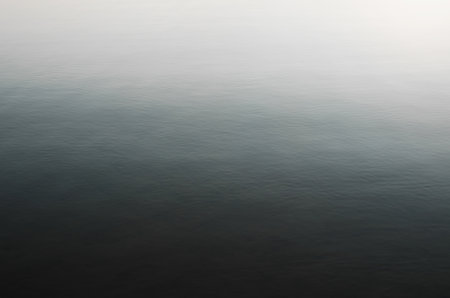 Top view clean calm dark blue soft water surface outdoors. Sea, lake, ocean.の写真素材