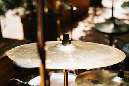 Drum kit, hi-hat cymbals at a street music festival on a sunny day. Close-up, selective focus.の写真素材