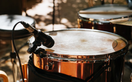 Drum set with a microphone at a street music festival. Close-up snare drum, selective focus on microphone.の写真素材