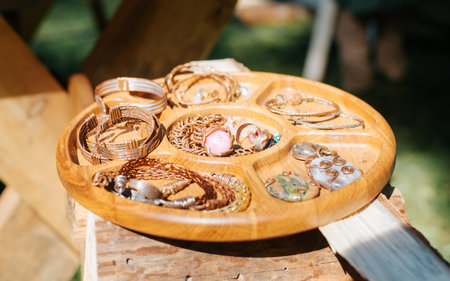 Medieval handmade metal jewelry sold at the market fair. Close-up, selective focus.の写真素材