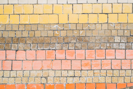 Old mosaic horizontal striped pattern, shabby small ceramic colorful decorative tiles.