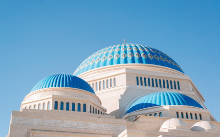 Beautiful mosque, blue dome with symbol of Islamic religion and faith, oriental architecture against clear blue sky on sunny day, exterior.の写真素材