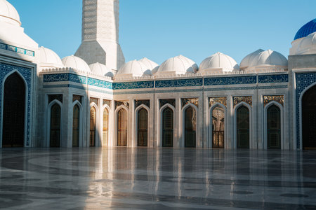 Exterior of a beautiful mosque, domes, arches and entrance doors close-up.の写真素材
