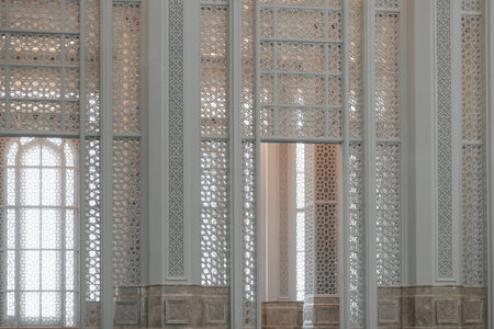 Beautiful white wooden walls, shutters with decorative elegant wood carvings indoors.の写真素材