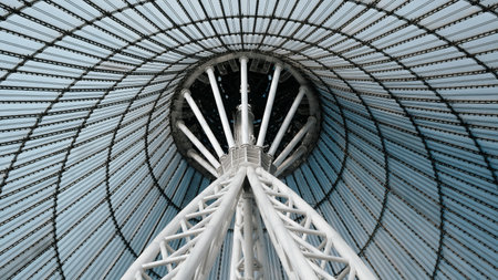 Futuristic tent-shaped roof, modern architecture close-up. Glass roof and steel pole, inside.の写真素材