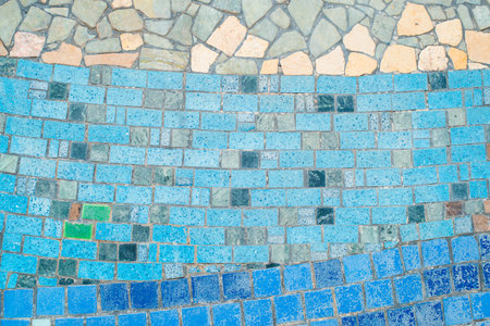 Old mosaic pattern, shabby small ceramic tiles.の写真素材