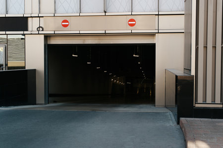 Open underground parking garage in a modern business center or residential building, exterior.