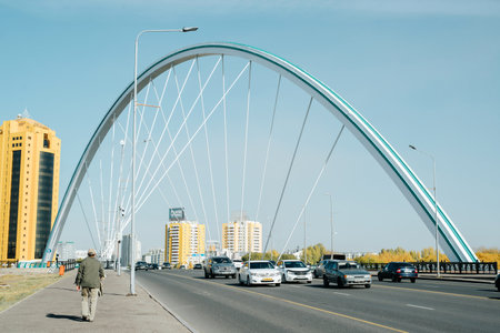 Close-up of Karaotkel bridge in Astana, road, cars and people. Kazakhstan, Astana 10/12/2022.の写真素材