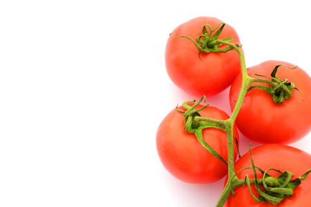 A bunch of tomatoes with a completely white backgroundの写真素材