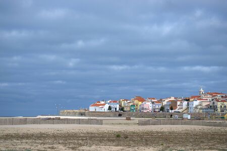 Sea side village on a still but very over cast morningの写真素材