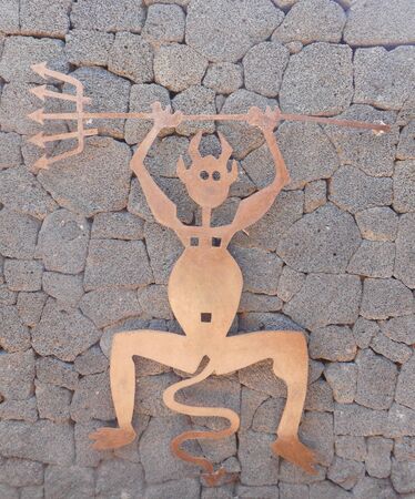 Devil figure in restaurant of Timanfaya National Park on the island of Lanzarote, Canary Islands in Spainのeditorial素材