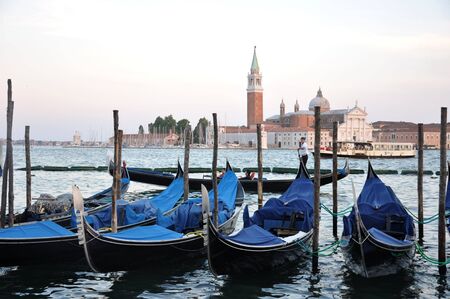 Gondolas moored to pole in the Grand Canal of Veniceのeditorial素材