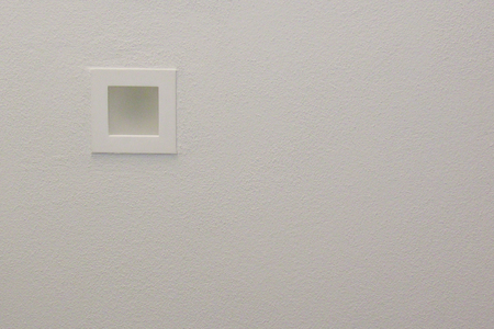 Plaster modern spotlight on suspended white ceiling