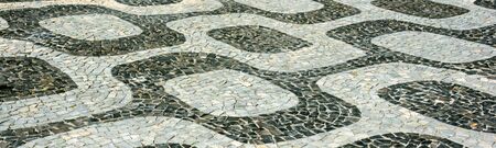 Black and white iconic mosaic, Portuguese pavement by old design pattern at Ipanema beach, Rio de Janeiro, Brazilの写真素材