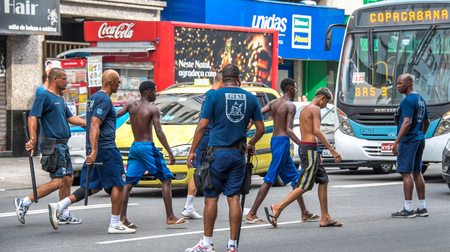 RIO DE JANEIRO, BRAZIL - DECEMBER 30, 2016: Policemen making arrest of criminals and leading them to police cars at Avenida Princesa Isabel during preparation Copacabana to New Year 2017 celebrationのeditorial素材