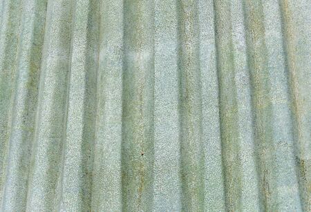 Texture of mosaic of triangle form of soapstone concrete wall with groovesの写真素材