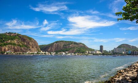 View of Morro da Urca, residential Botafogo neighborhood and luxury Yacht Club located on the shore of Guanabara Bay in Rio de Janeiro, Brazilの写真素材