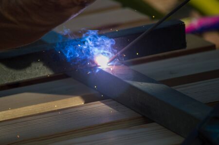 welding iron seen from close with flashes