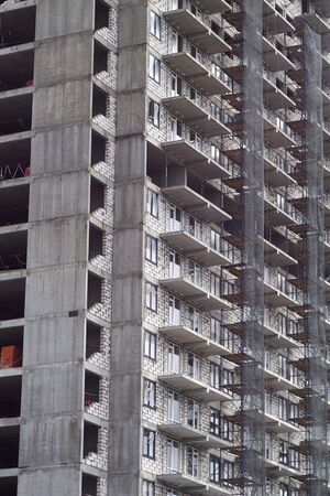 Fragment of panel concrete floors in a multi-storey building at the construction stage, without walls and windows. Side viewの写真素材